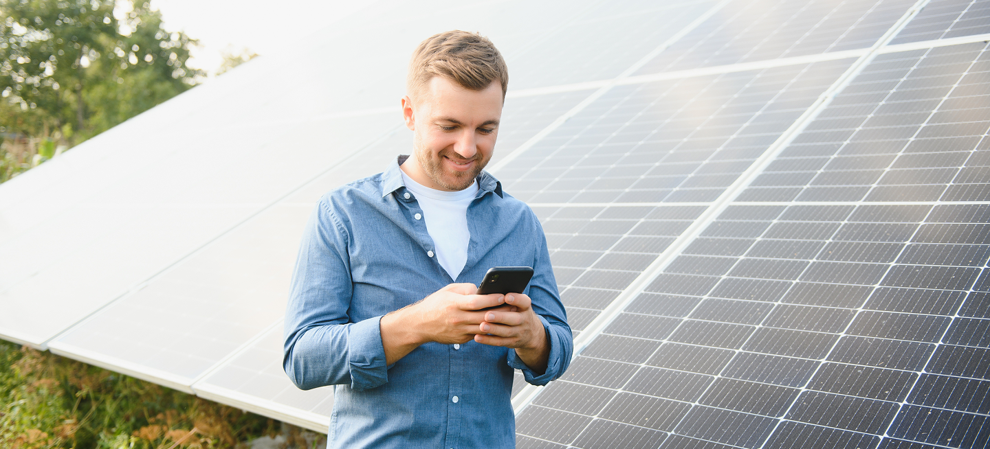young architect standing by solar panels 1